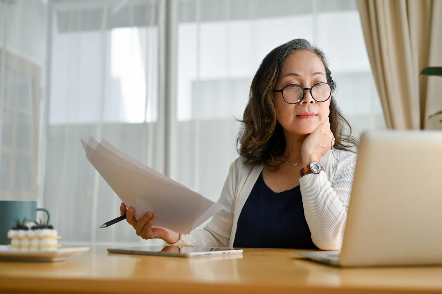 woman at desk using a laptop computer